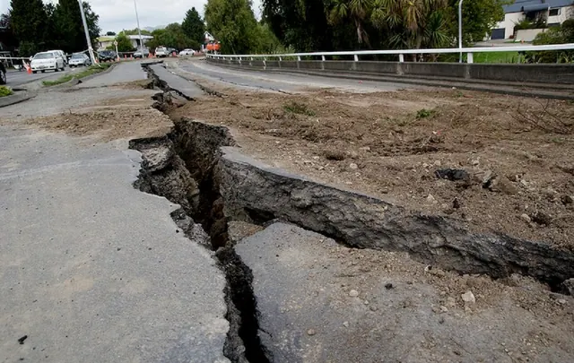 An archive photograph of a damaged road