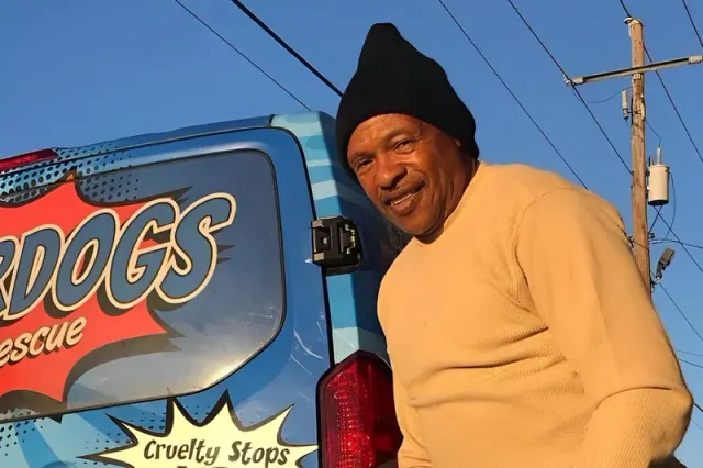 Keith Walker beside a W-Underdogs vehicle