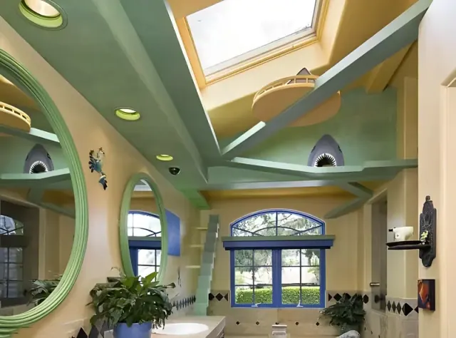 Green walkways and a yellow platform beneath a bathroom skylight.