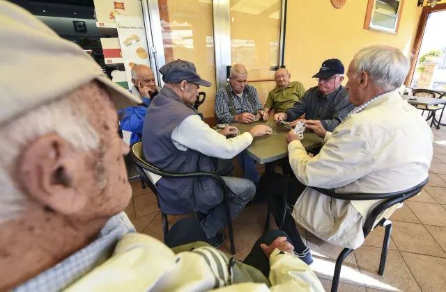 Older adults gathered around a table