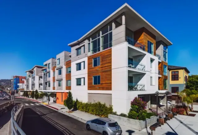 Apartment building beside a street