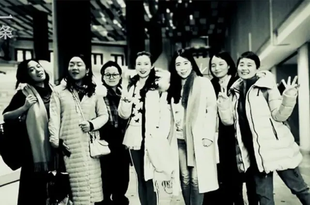 Seven friends standing together