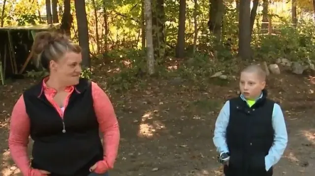 Hope and Landin speaking outdoors