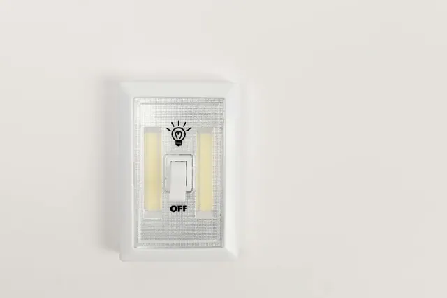 A wall switch in the off position