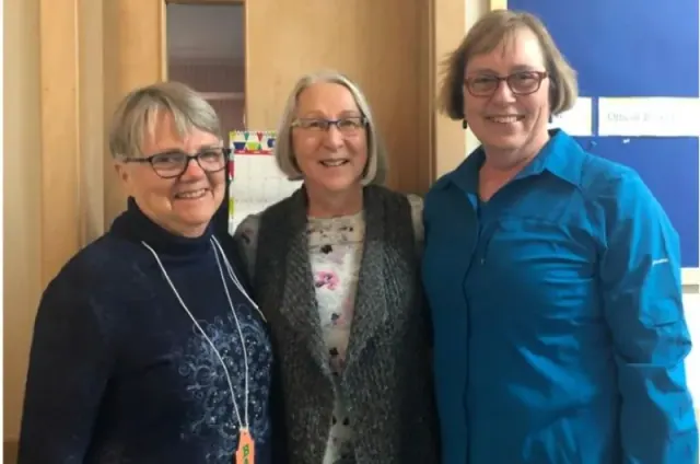 Three women posing together