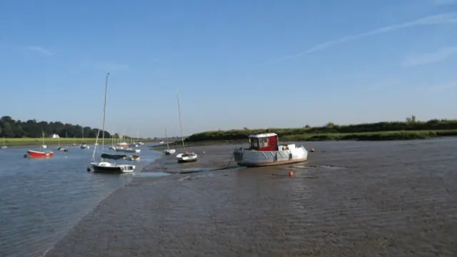 Boats at low water on the River Deben in an archive photograph