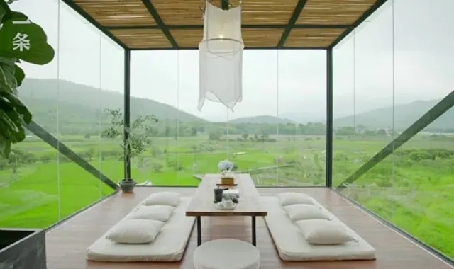 Tea room with windows overlooking green fields