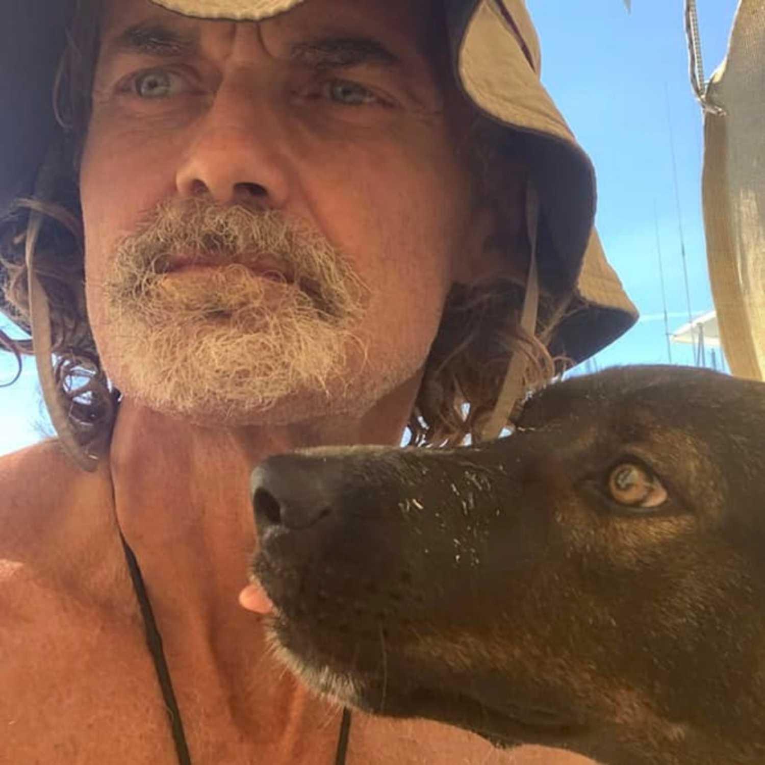 Tim Shaddock beside Bella aboard a vessel.