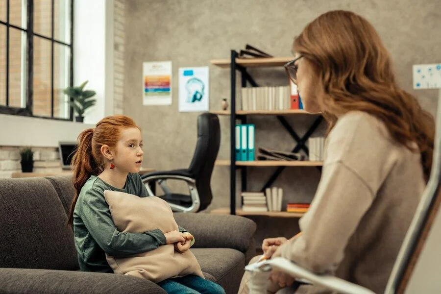 School counselor sitting with a child who seems upset