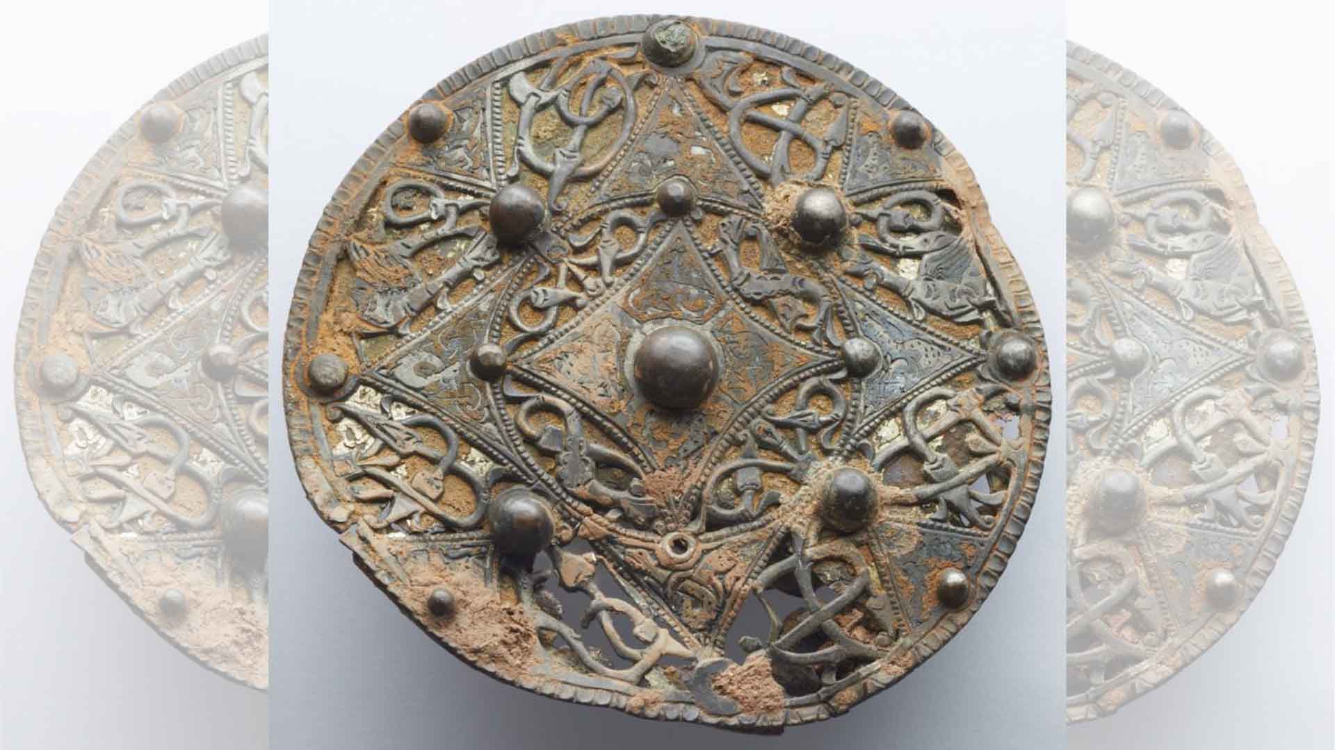 The Cheddar disc brooch in a Museum of Somerset photograph.