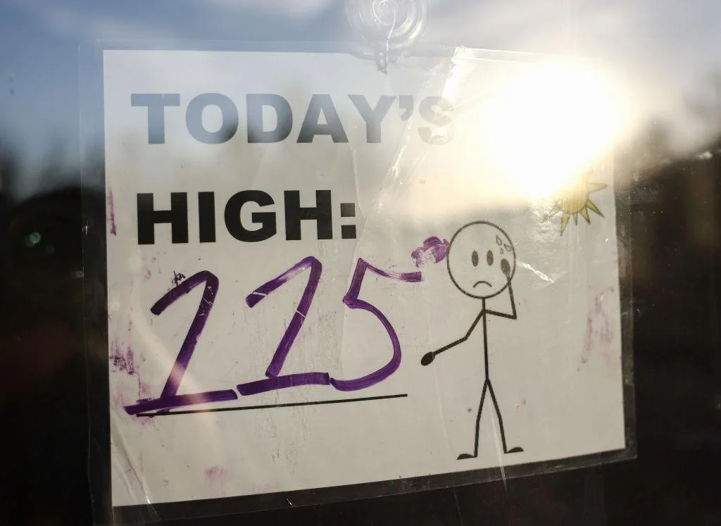 Sign in Phoenix, Arizona sign that says “Today’s High: 115”