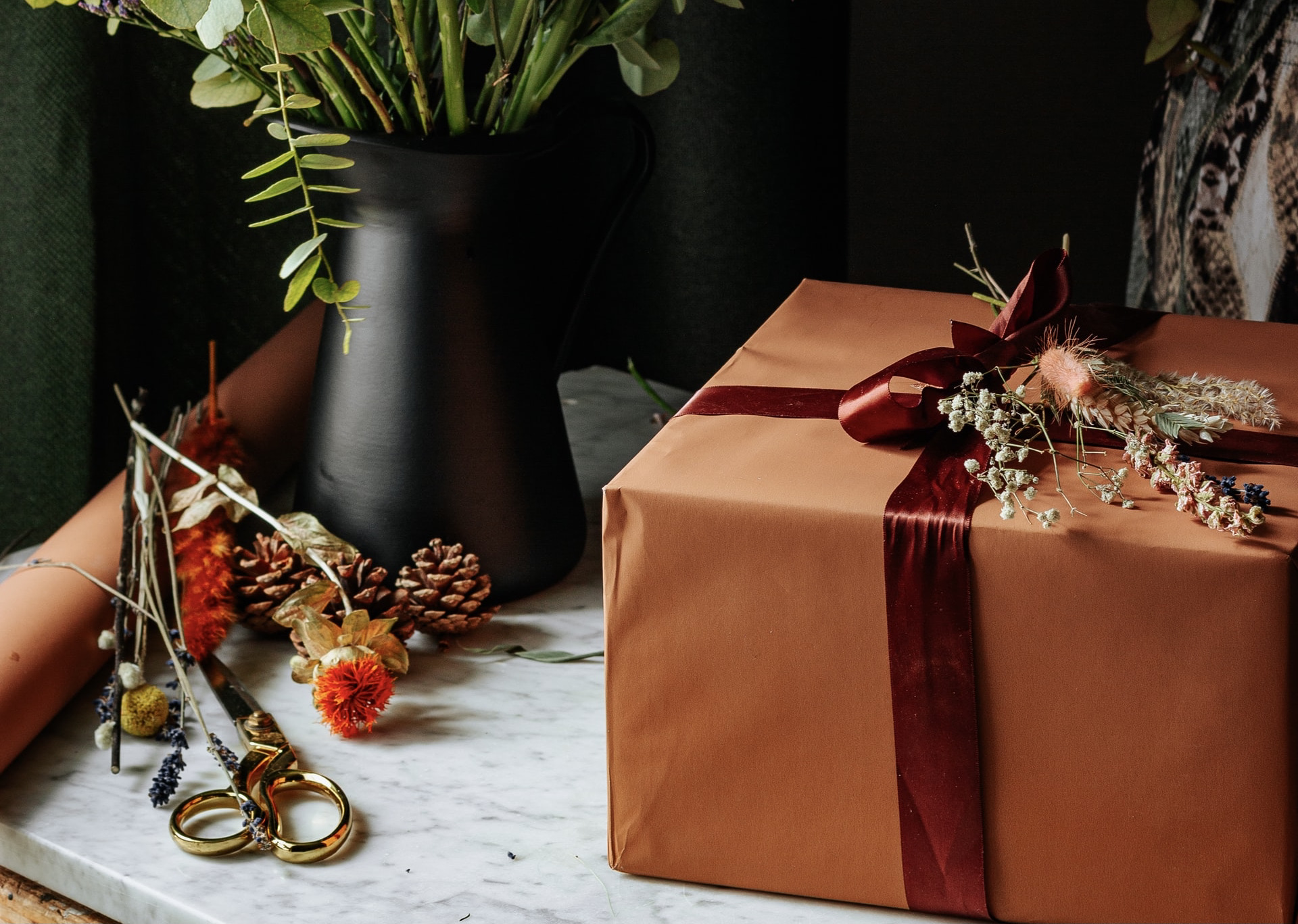 Wrapped gifts and craft materials on a table