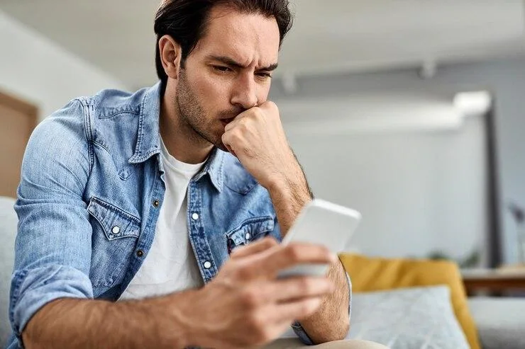 Man writes negative comments under a post on a popular social media platform