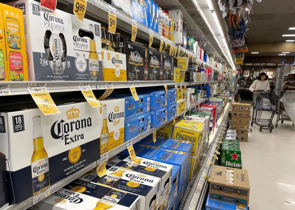 Corona, Modelo, and other cases of beer in a grocery store