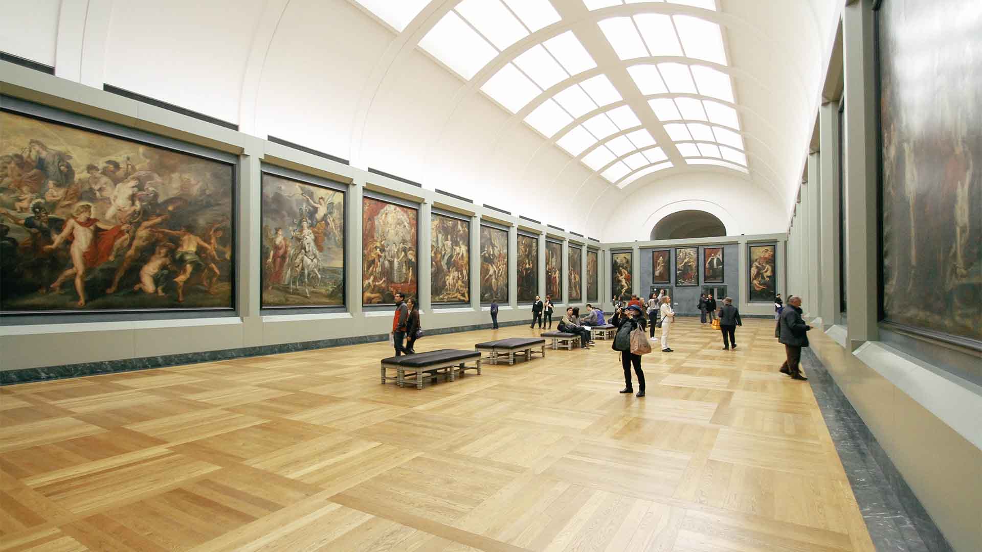 Illustrative photograph of a gallery displaying paintings.
