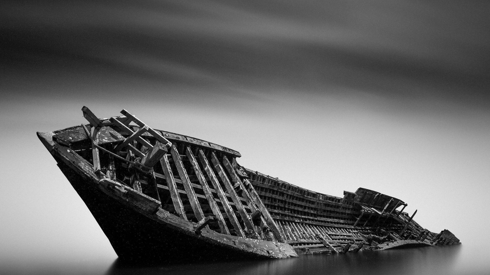 Illustrative black-and-white photograph of another wooden wreck.