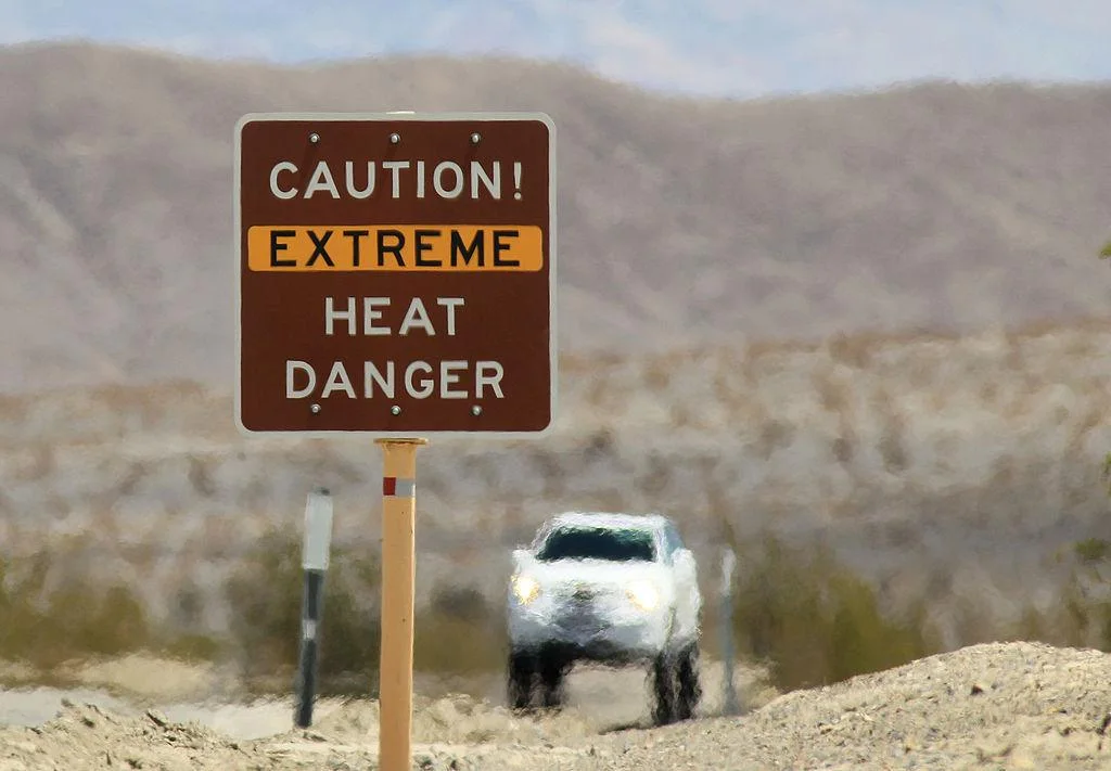A sign in Death Valley National Park, CA, reads, “Caution! Extreme Heat Danger”